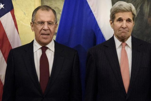 Russian Foreign Minister Lavrov stand with U.S. Secretary of State Kerry before a meeting in Vienna, Austria